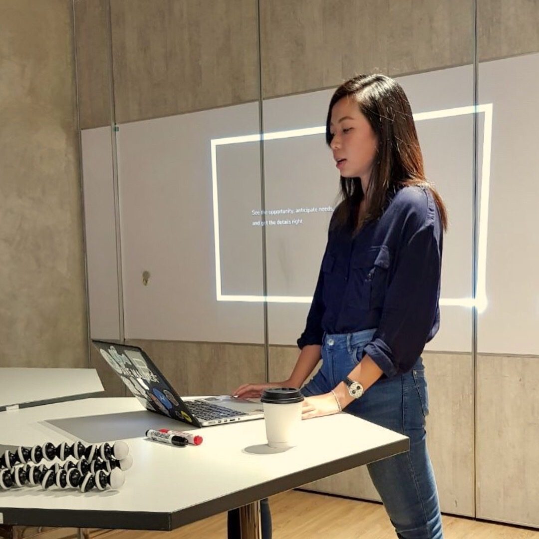 Clarizza presenting at a lectern
